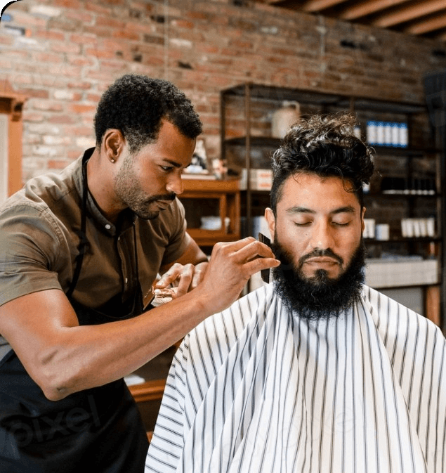 Barber trimming a client's beard