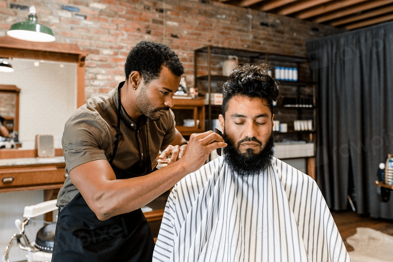 Barber styling a seated client