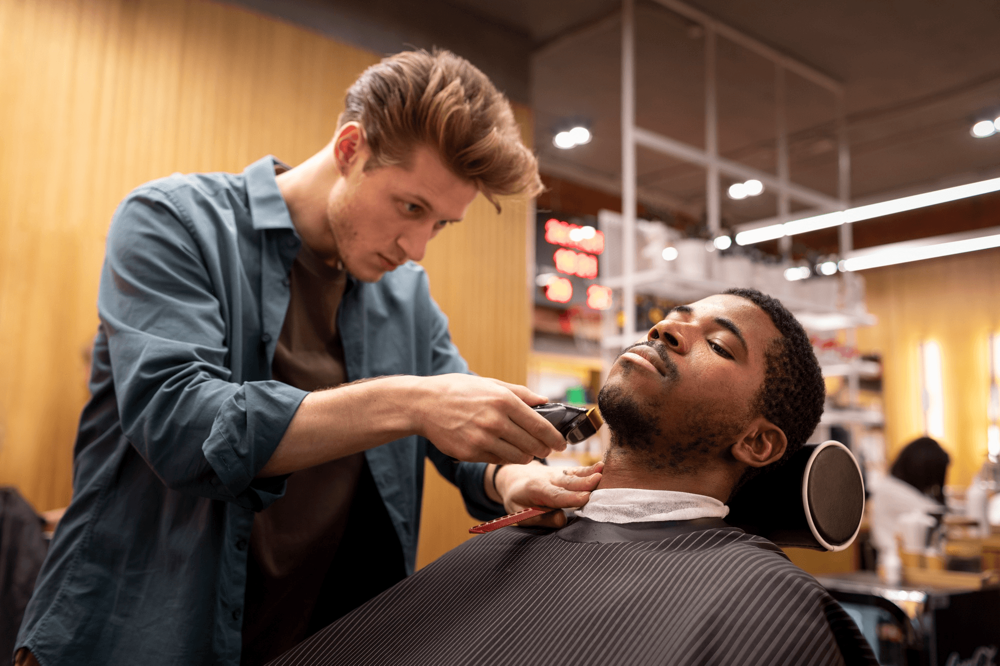 Barber trimming a client’s beard