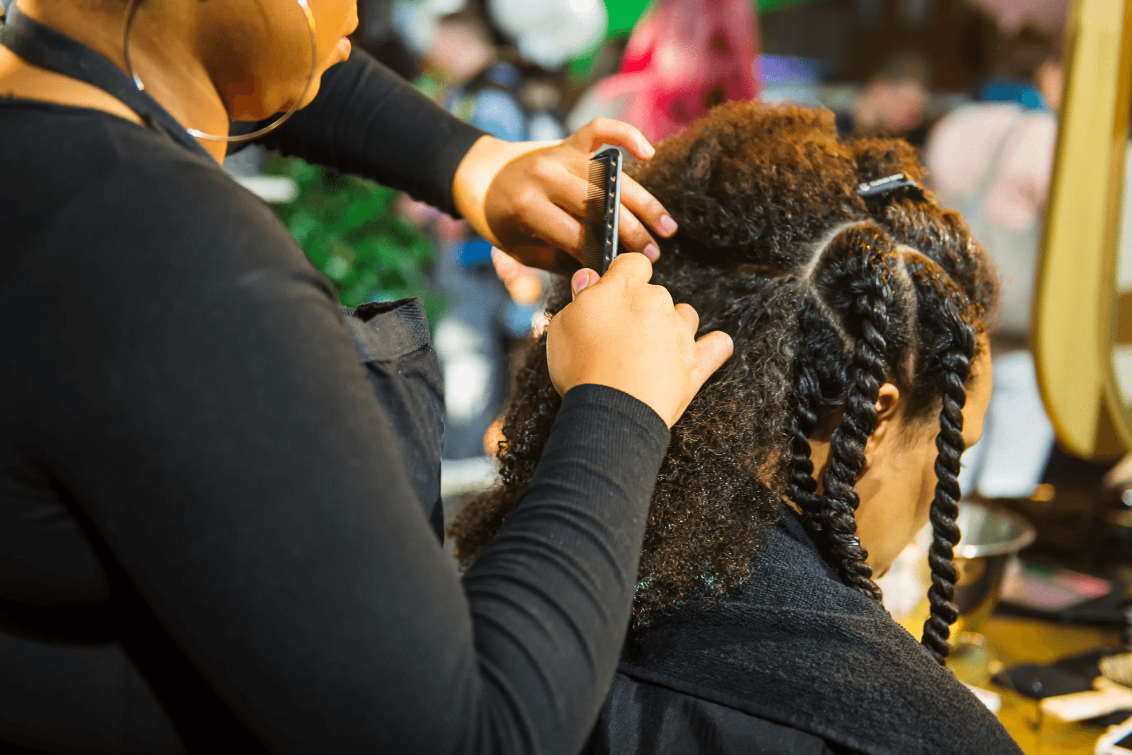 A stylist working with a client